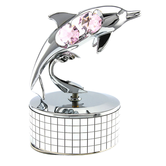 Decorative dolphin figurine with pink crystals on a white background